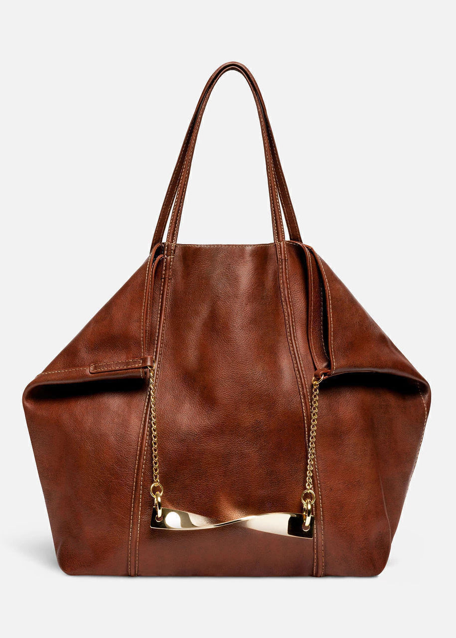 Brown leather handbag with gold accents on a light gray background