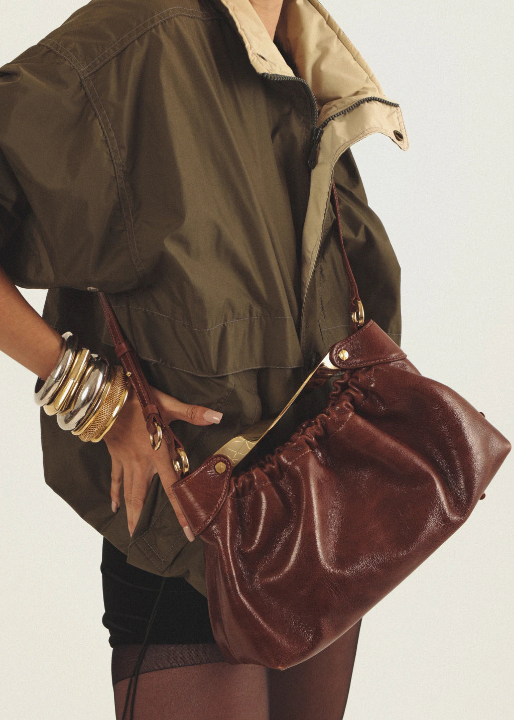 brown leather bag with golden hardware