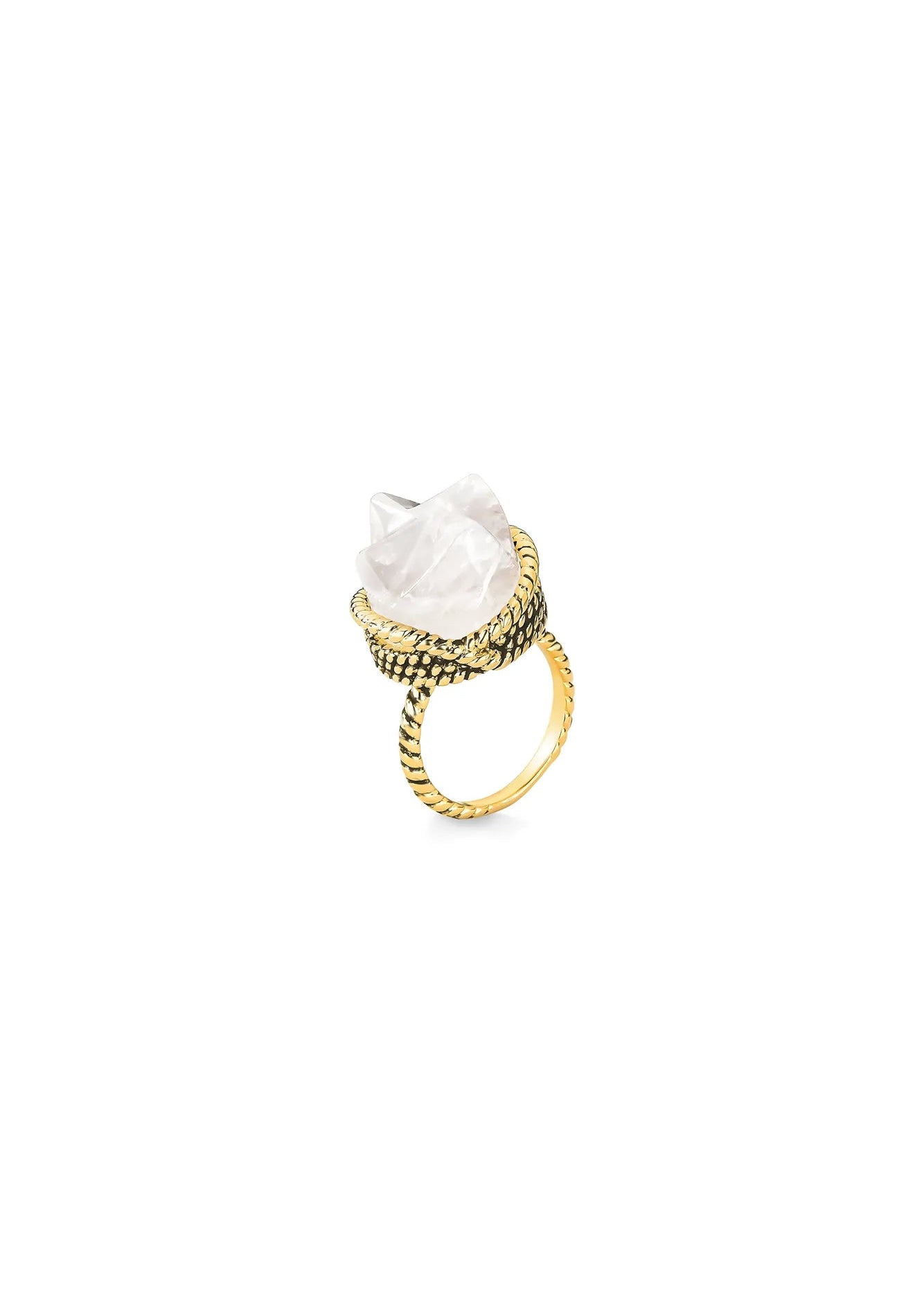 Gold ring with a large white stone on a white background