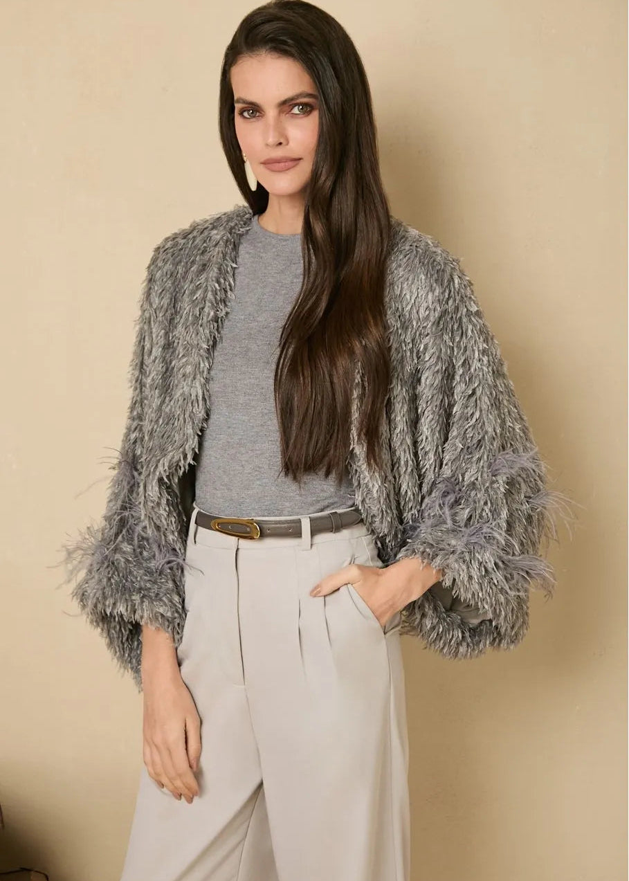 Grey poncho w feather details