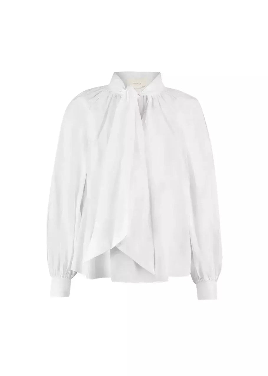 white shirt with a bow in the neck 