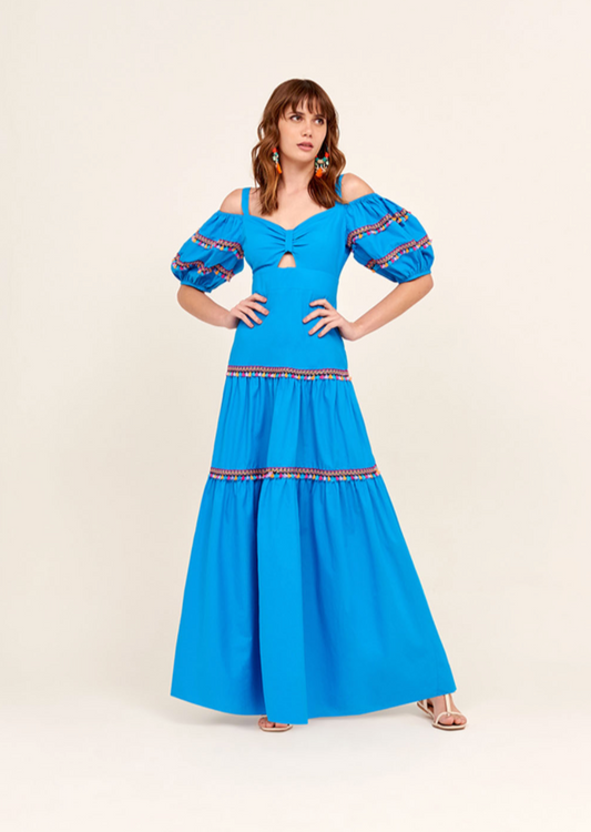 Turquoise long dress, with puff sleeves and embroidred colorful details. Available at Frida Brazilian Boutique.